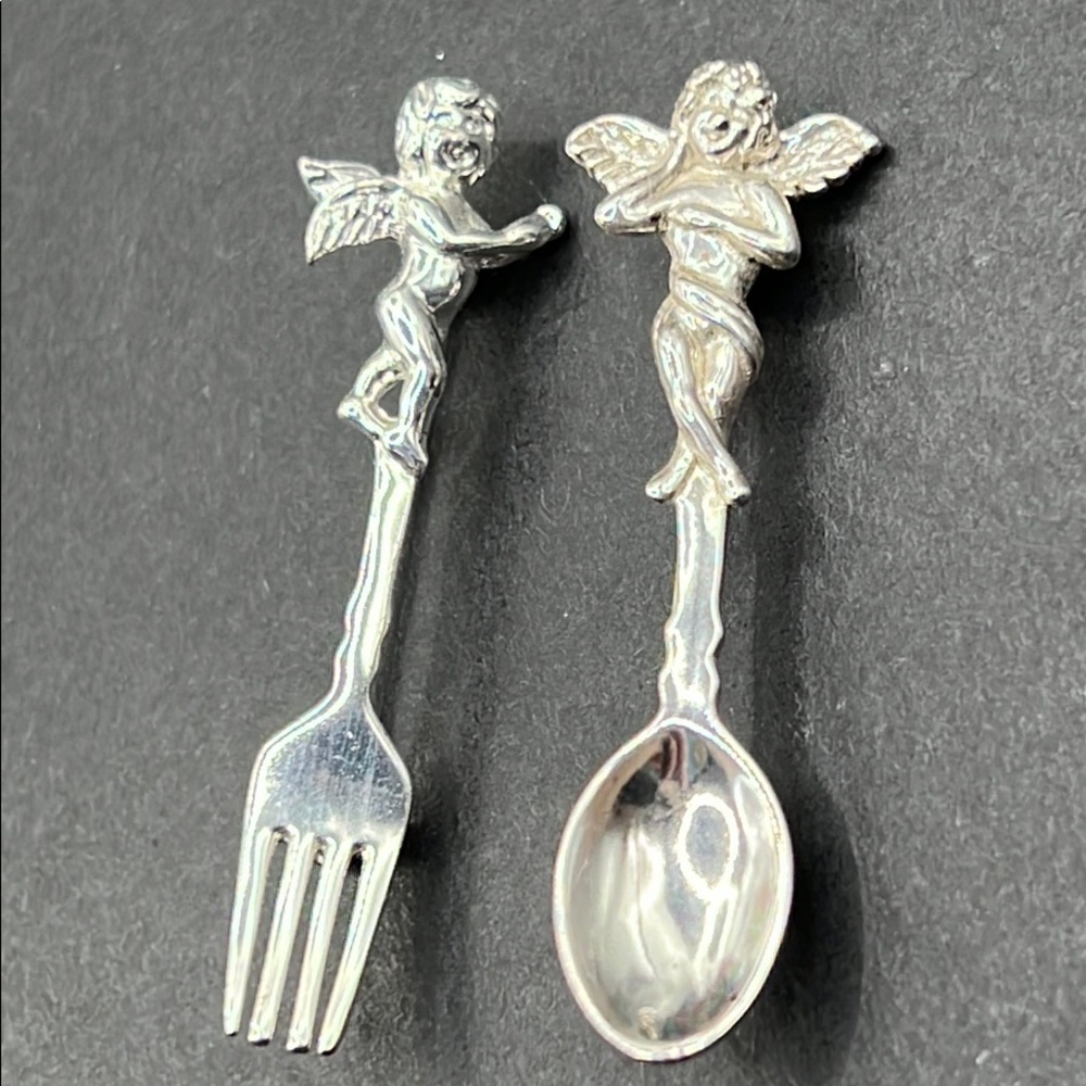 Vintage AIM cherub fork/spoon brooch set